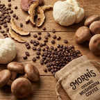 Mushrooms, coffee beans, and a Mornis Organic Mushroom Coffee bag on a wooden surface.